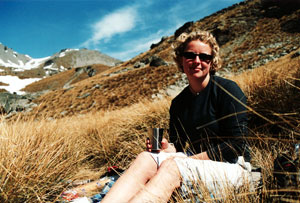 Caroline sitting in the tussocks in the South Island high country, 2002.