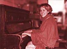 Caroline reunited with her piano, Heriot Row, February 2003.